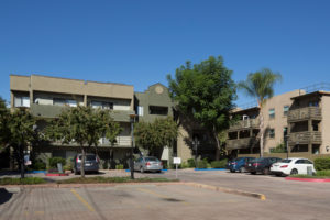 Exterior with balconies, parking lot